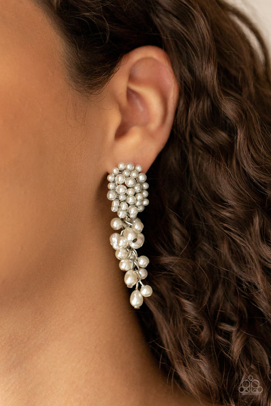 Fabulously Flattering White Pearl Earring - Paparazzi Accessories  Featuring imperfect finishes, a bubbly tassel of white pearls trickles from the bottom of a pearl encrusted silver fitting for a timeless look. Earring attaches to a standard post fitting.  All Paparazzi Accessories are lead free and nickel free!  Sold as one pair of post earrings.