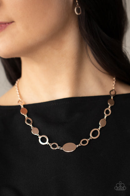 Working OVAL-time Rose Gold Necklace - Paparazzi Accessories  A shiny series of glistening rose gold discs and oval frames delicately link below the collar, creating a casual statement. Features an adjustable clasp closure.  Sold as one individual necklace. Includes one pair of matching earrings.  All Paparazzi Accessories are lead free and nickel free!   Get The Complete Look!  Bracelet: "OVAL and Out - Rose Gold" (Sold Separately)