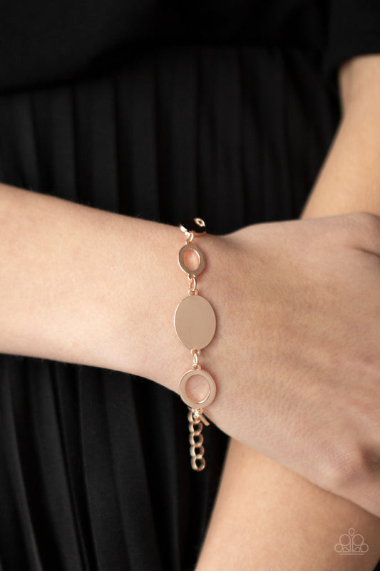 OVAL and Out Rose Gold Bracelet - Paparazzi Accessories  A shiny series of glistening rose gold discs and oval frames delicately link around the wrist, creating a casual statement. Features an adjustable clasp closure.  All Paparazzi Accessories are lead free and nickel free!   Sold as one individual bracelet.  Get The Complete Look!  Necklace: "Working OVAL-time - Rose Gold" (Sold Separately)