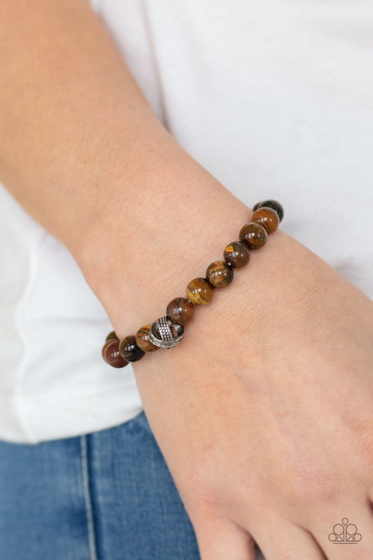 ZEN Commandments Brown Urban Bracelet - Paparazzi Accessories  Infused with textured silver accents, an earthy collection of tiger's eye stones are threaded along a stretchy band around the wrist for a seasonal fashion.  All Paparazzi Accessories are lead free and nickel free!  Sold as one individual bracelet.