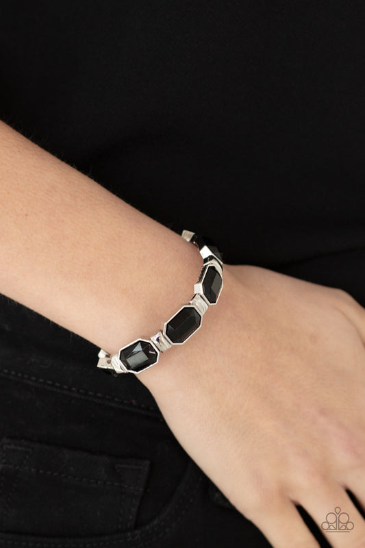 Fashion Fable Black Bracelet - Paparazzi Accessories  Encased in sleek silver fittings, faceted black beads join dainty silver rectangular frames along stretchy bands around the wrist for a dainty pop of color.  All Paparazzi Accessories are lead free and nickel free!  Sold as one individual bracelet.