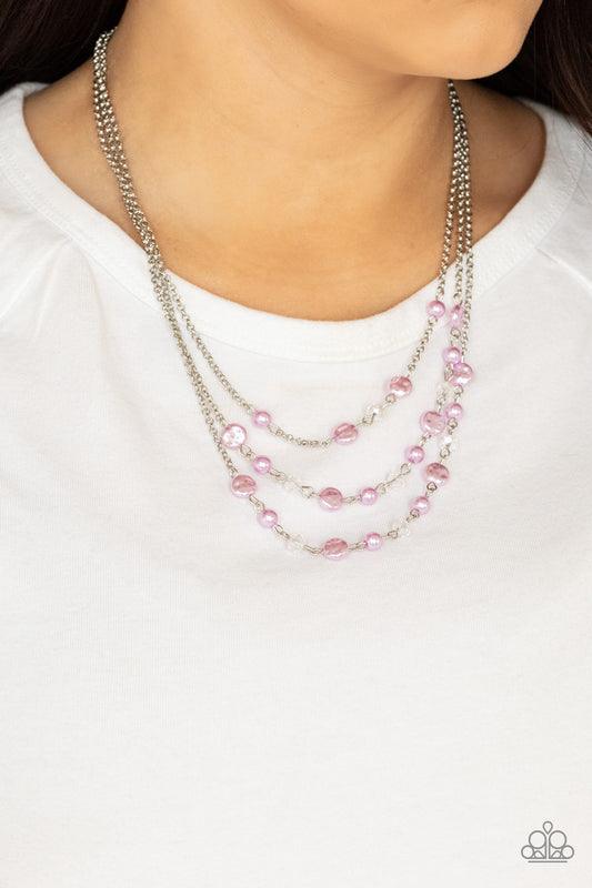 Let The Record GLOW Purple Necklace - Paparazzi Accessories.  Dainty purple pearls, glassy crystal-like beads, and imperfect purple pearly accents sporadically link with sections of shimmery silver chains, creating timeless layers below the collar. Features an adjustable clasp closure.  ﻿﻿﻿All Paparazzi Accessories are lead free and nickel free!  Sold as one individual necklace. Includes one pair of matching earrings.