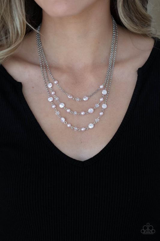 Let The Record GLOW Pink Necklace - Paparazzi Accessories  Dainty pink pearls, glassy crystal-like beads, and imperfect pink pearly accents sporadically link with sections of shimmery silver chains, creating timeless layers below the collar. Features an adjustable clasp closure.  All Paparazzi Accessories are lead free and nickel free!  Sold as one individual necklace. Includes one pair of matching earrings.