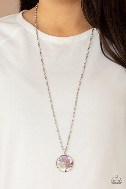 Evergreen Eden Multi Necklace - Paparazzi Accessories. A leafy collection of colorful wildflowers is encased inside a glassy frame, creating a whimsical pendant at the bottom of the lengthened silver chain. Features an adjustable clasp closure.  All Paparazzi Accessories are lead free and nickel free!  Sold as one individual necklace. Includes one pair of matching earrings.