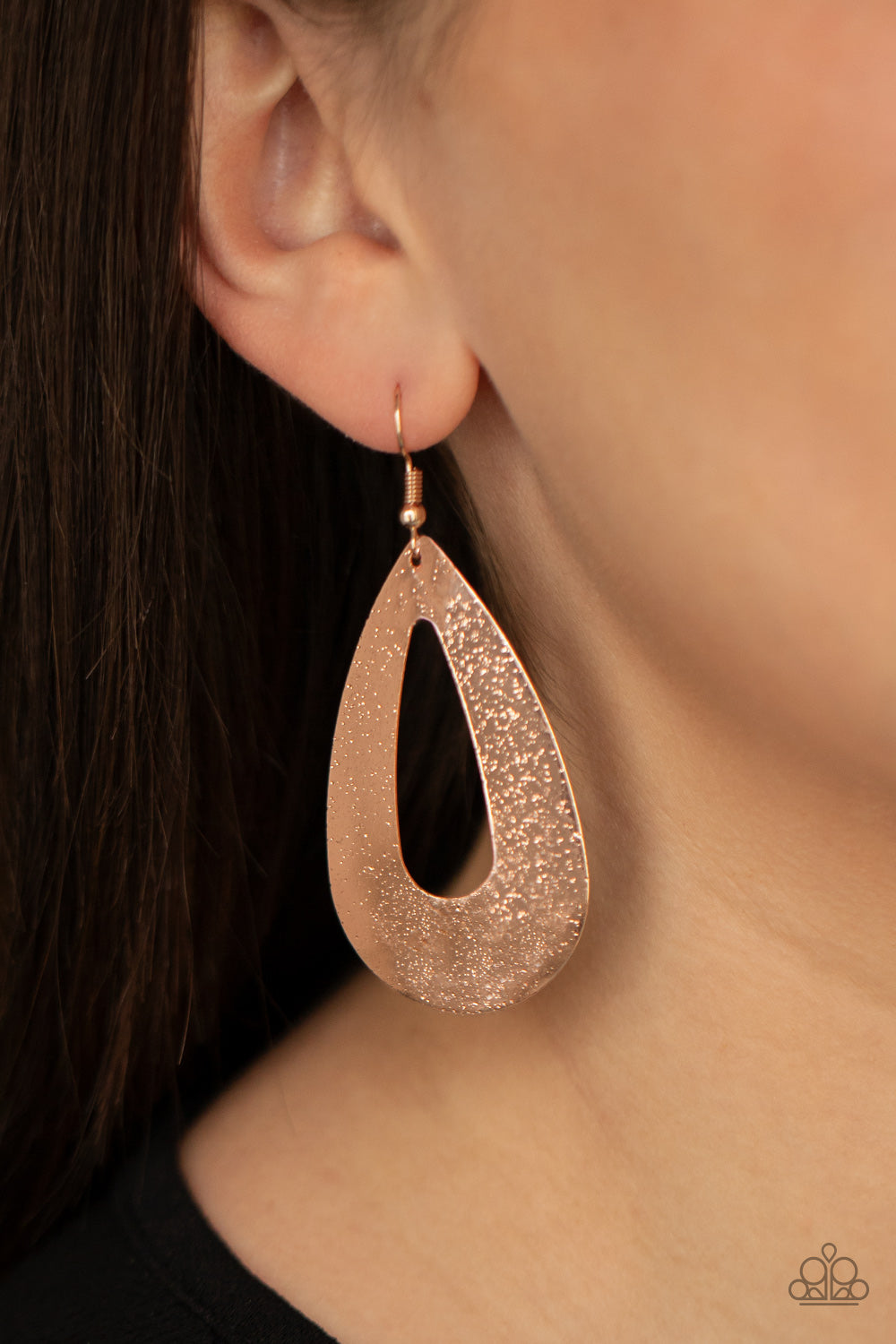Hand It OVAL! - Rose Gold Item #P5BA-GDRS-081XX Delicately hammered in an endless rose gold shimmer, a flat glistening oval silhouette swings from the ear for a beautiful basic look. Earring attaches to a standard fishhook fitting.  Sold as one pair of earrings.