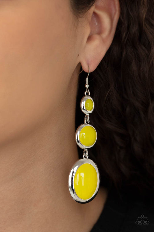 Retro Reality Yellow Earring - Paparazzi Accessories  Mismatched glassy yellow beads are encased in sleek silver frames that whimsically link into a colorfully retro lure. Earring attaches to a standard fishhook fitting.  All Paparazzi Accessories are lead free and nickel free!  Sold as one pair of earrings.