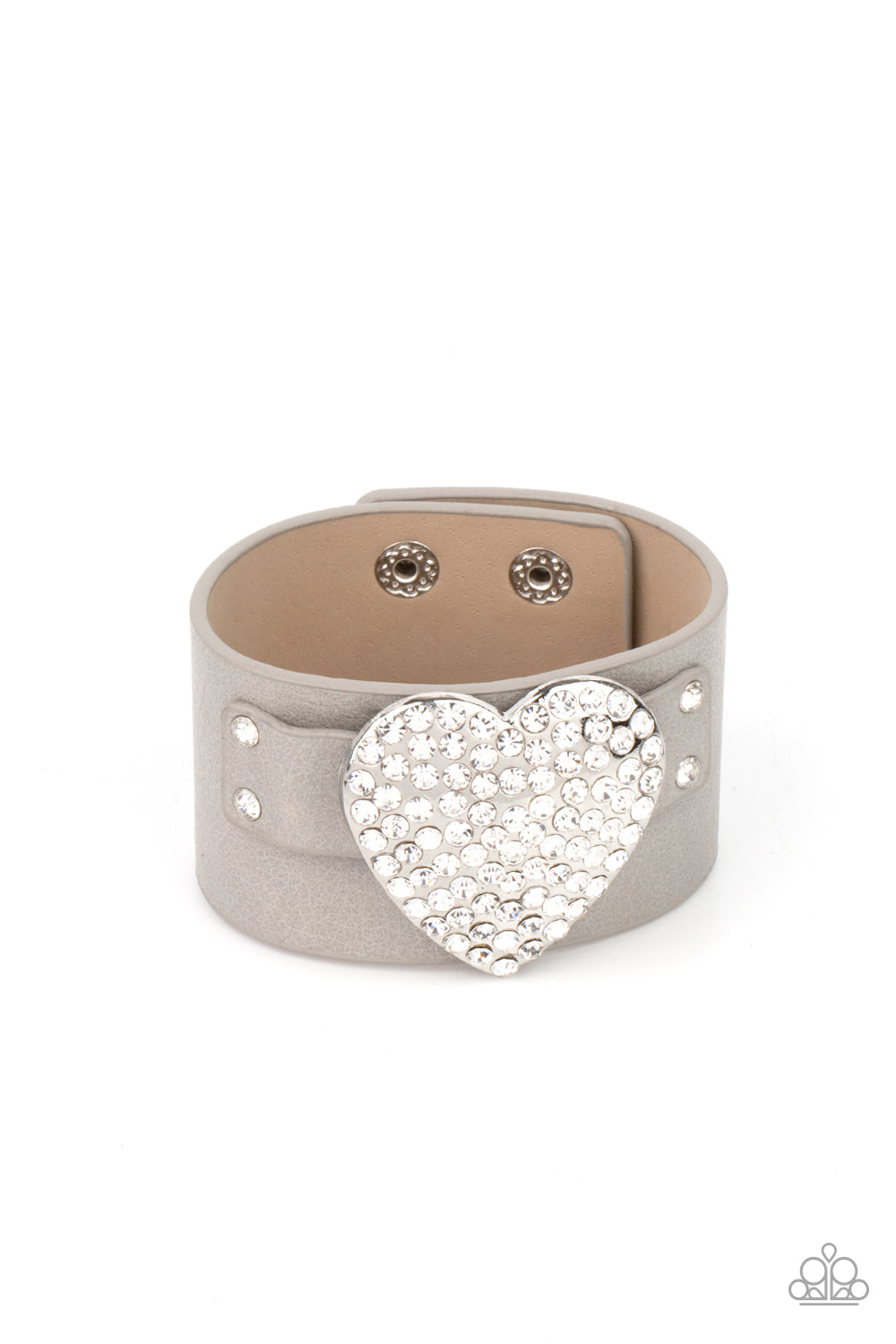 Flauntable Flirt Silver Wrap Bracelet - Paparazzi Accessories  Encrusted in blinding white rhinestones, an oversized silver heart frame is studded in place across the front of a gray leather band, creating a flirtatious centerpiece around the wrist. Features an adjustable snap closure.  All Paparazzi Accessories are lead free and nickel free!  Sold as one individual bracelet.