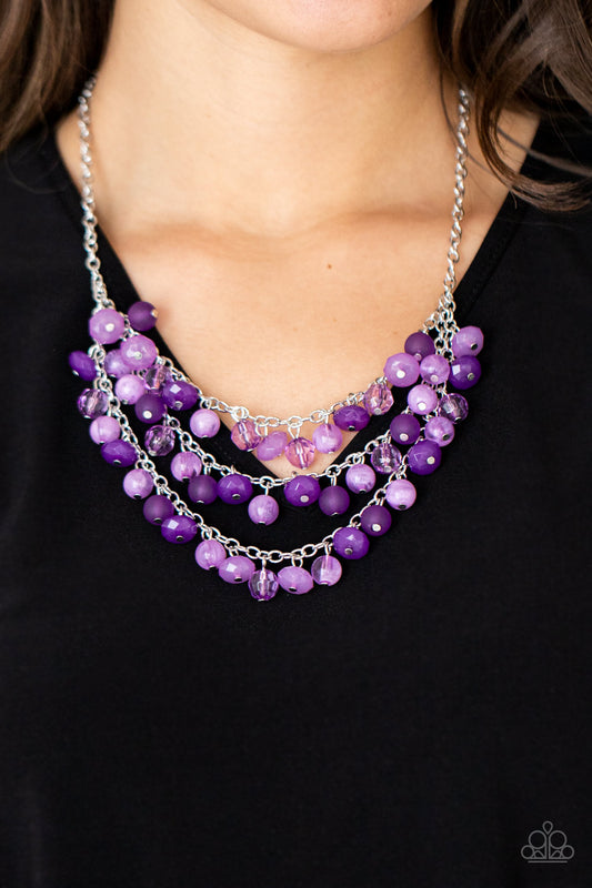 Fairytale Timelessness Purple Necklace - Paparazzi Accessories. Varying in shape and opacity, a mismatched collection of light and dark purple crystal-like beads drip from the shimmery silver chains, creating an enchanted layered fringe below the collar. Features an adjustable clasp closure.  All Paparazzi Accessories are lead free and nickel free!  Sold as one individual necklace. Includes one pair of matching earrings.
