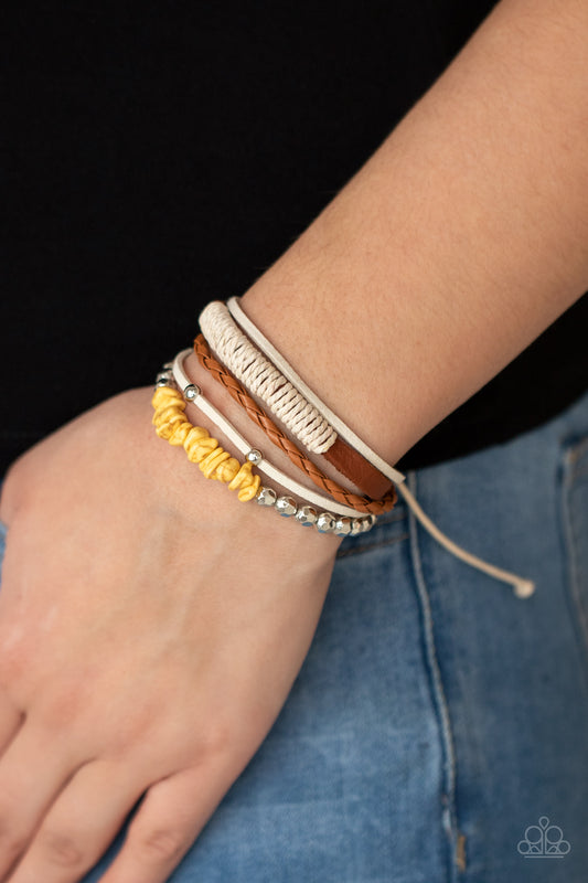 Keep At ROAM Temperature Yellow Urban Bracelet - Paparazzi Accessories. A strand of yellow pebbles and faceted silver beads joins rustic suede and leather bands around the wrist, creating earthy layers. Features an adjustable sliding knot closure.  All Paparazzi Accessories are lead free and nickel free!  Sold as one individual bracelet.