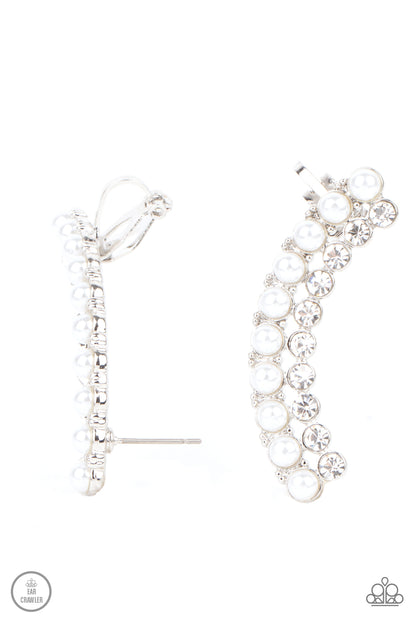 Doubled Down On Dazzle White Ear Crawler - Paparazzi Accessories  Featuring classic silver fittings, two rows of dainty white pearls and glassy white rhinestones arch into a timeless statement piece. Earring attaches to a standard post earring. Features a clip-on fitting at the top for a secure fit.  All Paparazzi Accessories are lead free and nickel free!  Sold as one pair of ear crawlers.