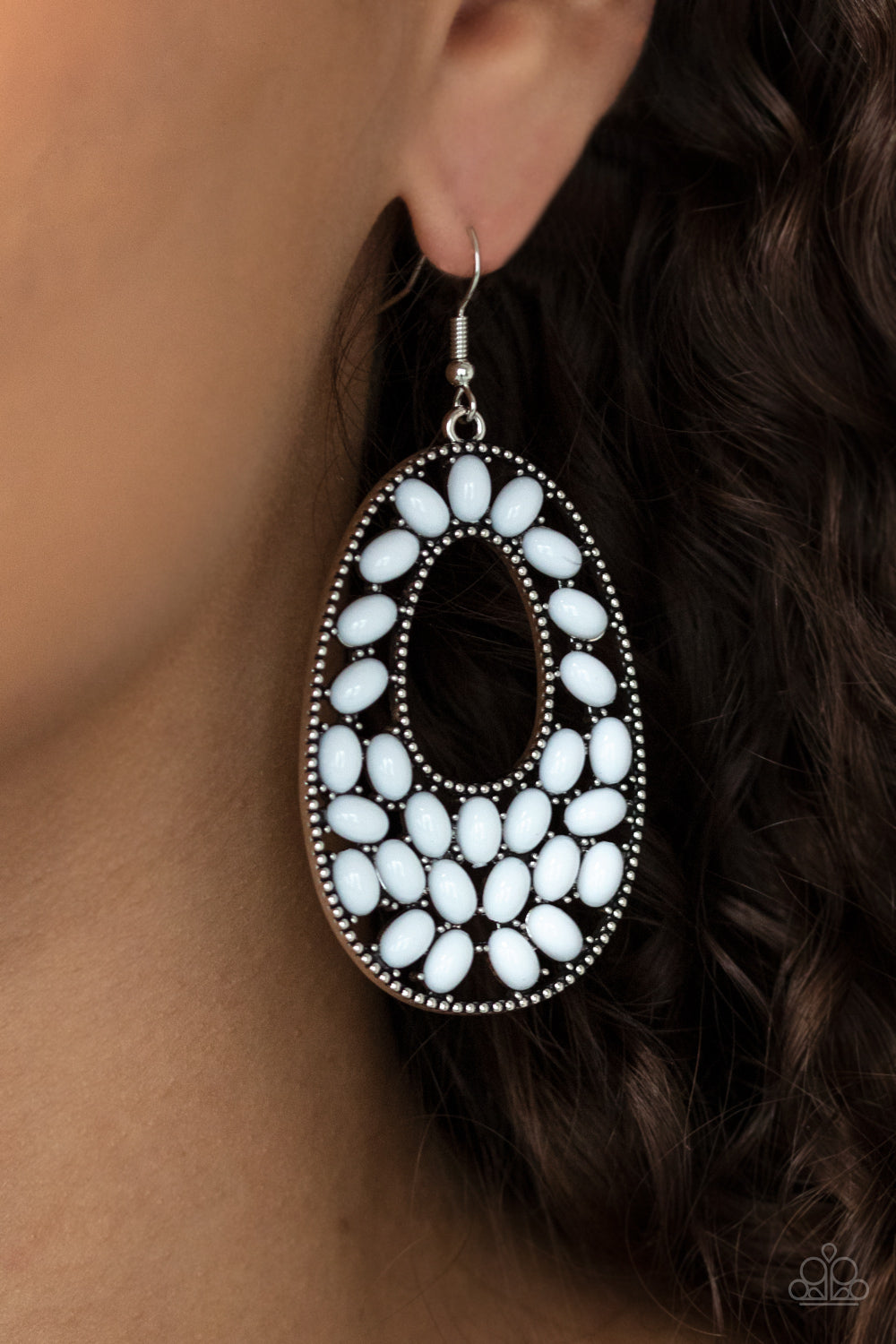 Beaded Shores White Earring - Paparazzi Accessories.  A collection of oval white beads collect inside a studded silver oval frame, creating a bright pop of color. Earring attaches to a standard fishhook fitting.  ﻿﻿﻿All Paparazzi Accessories are lead free and nickel free!  Sold as one pair of earrings.