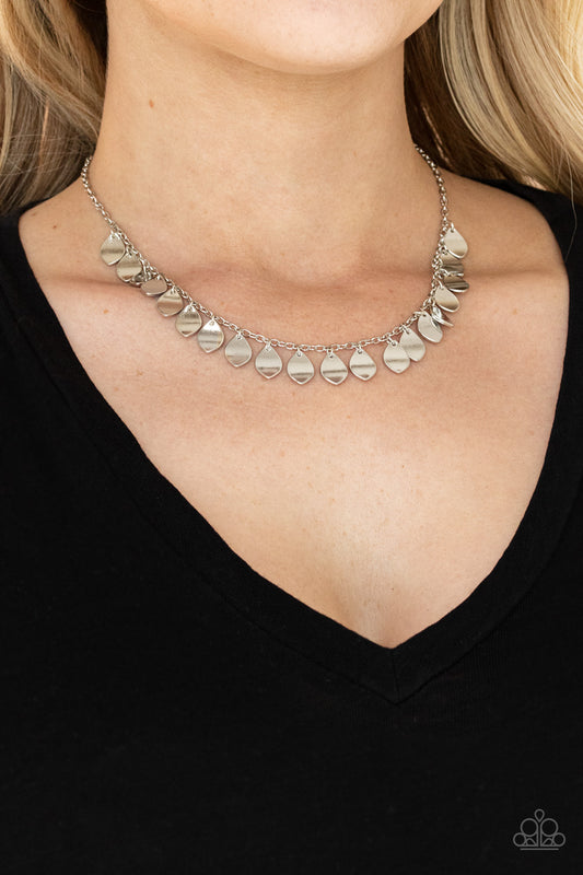 Dainty DISCovery Silver Necklace - Paparazzi Accessories. Teardrop silver discs drip from a dainty silver chain, creating a shimmery fringe below the collar. Features an adjustable clasp closure.  All Paparazzi Accessories are lead free and nickel free!  Sold as one individual necklace. Includes one pair of matching earrings.