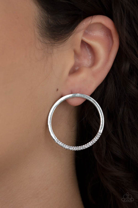 Spot On Opulence White Post Earring - Paparazzi Accessories As if dipped in glitter, the bottom of a flat silver hoop is encrusted in dainty white rhinestones for a classic shimmer. Earring attaches to a standard post fitting.  All Paparazzi Accessories are lead free and nickel free!  Sold as one pair of post earrings.