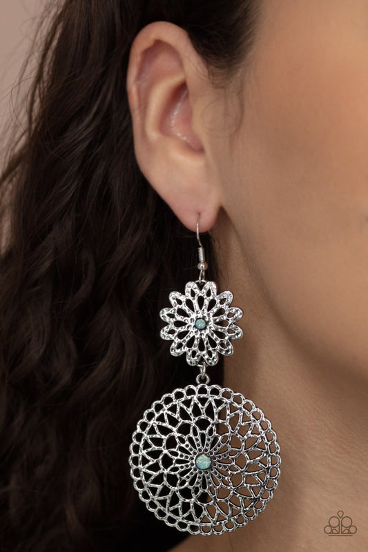 Garden Mantra Blue Earring - Paparazzi Accessories. Dotted with Cerulean opal rhinestone centers, a hammered silver floral frame links with an oversized silver mandala-like frame, creating a whimsical lure. Earring attaches to a standard fishhook fitting.  All Paparazzi Accessories are lead free and nickel free!  Sold as one pair of earrings.