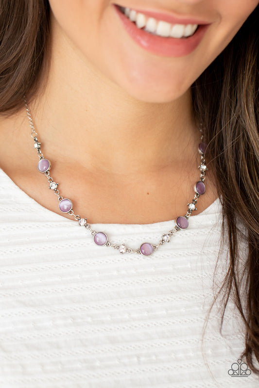 Inner Illumination Purple Necklace - Paparazzi Accessories  Encased in antiqued silver fittings, dainty white rhinestones and glowing Amethyst Orchid cat's eye stones delicately link below the collar for a timeless finish. Features an adjustable clasp closure.  All Paparazzi Accessories are lead free and nickel free!  Sold as one individual necklace. Includes one pair of matching earrings.  Get The Complete Look!  Bracelet: "Use Your ILLUMINATION - Purple" (Sold Separately)