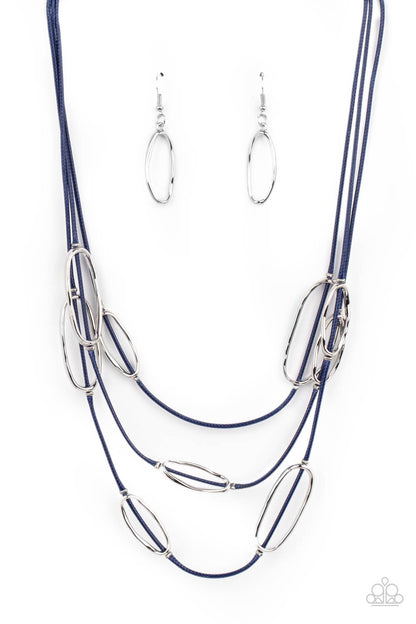 Check Your CORD-inates - Blue Item #P2SE-BLXX-445XX An asymmetrical collection of hammered silver ovals are fitted in place along three rows of shiny blue cords, creating an edgy display below the collar. Features an adjustable clasp closure.  Sold as one individual necklace. Includes one pair of matching earrings.