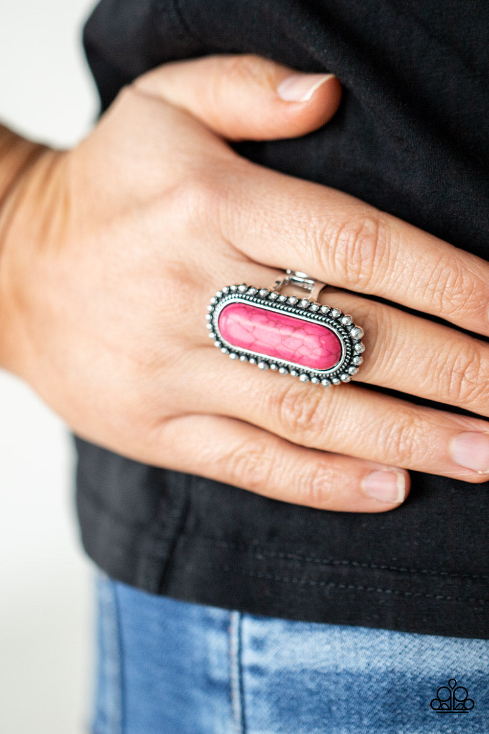 Sedona Scene Pink Ring - Paparazzi Accessories  An oblong pink stone is nestled inside an oversized studded silver frame, creating a colorfully rustic centerpiece atop the finger. Features a stretchy band for a flexible fit.  All Paparazzi Accessories are lead free and nickel free!  Sold as one individual ring.