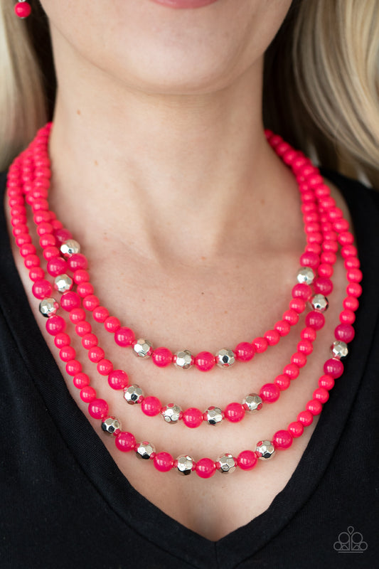 STAYCATION All I Ever Wanted Pink Necklace - Paparazzi Accessories  A colorful collection of polished pink beads, faceted silver beads, and opaque pink beads are threaded along invisible wires across the chest, creating vivacious layers. Features an adjustable clasp closure.  All Paparazzi Accessories are lead free and nickel free!  Sold as one individual necklace. Includes one pair of matching earrings.