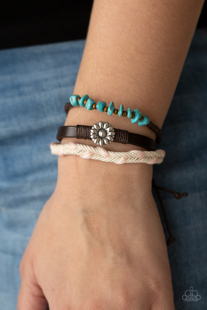 Terrain Trend Pink Urban Bracelet - Paparazzi Accessories  Featuring a silver floral centerpiece, mismatched strands of turquoise stones and wooden beads, brown leather, and braided pink and white cording layers across the wrist for a seasonal flair. Features an adjustable sliding knot closure.  All Paparazzi Accessories are lead free and nickel free!  Sold as one individual bracelet.