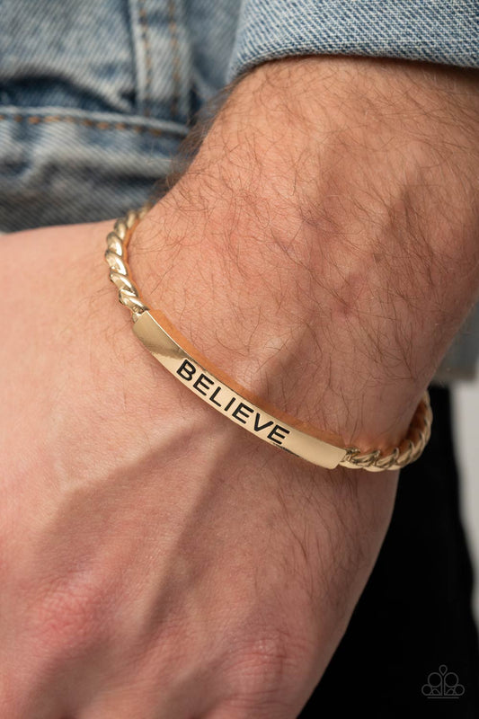 Keep Calm and Believe Gold Cuff Bracelet - Paparazzi Accessories  Twisted gold bars attach to a shiny gold plate stamped in the word, "BELIEVE," creating an inspiring cuff around the wrist.  All Paparazzi Accessories are lead free and nickel free!  Sold as one individual necklace.