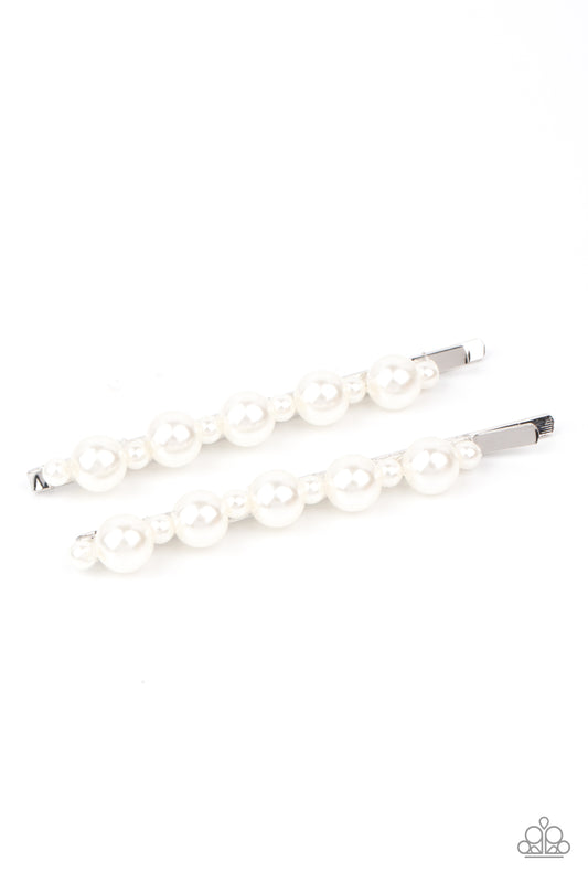 Put A Pin In It White Hair Clip - Paparazzi Accessories.  Dainty and classic pearls alternate along a pair of silver bobby pins, creating a bubbly display.  All Paparazzi Accessories are lead free and nickel free!  Sold as one pair of decorative bobby pins.