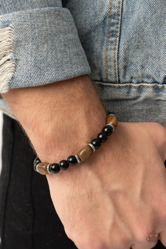 Unity Brown Urban Bracelet - Paparazzi Accessories  Infused with dainty silver accents, glassy black and tiger's eye stone beads are threaded along a stretchy band around the wrist for a stackable seasonal look.  All Paparazzi Accessories are lead free and nickel free!  Sold as one individual bracelet.