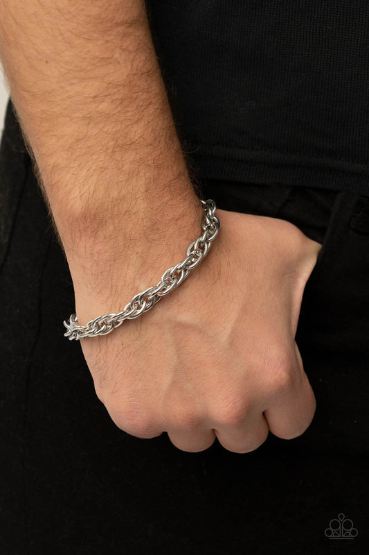 Executive Exclusive Silver Urban Bracelet - Paparazzi Accessories. Double linked silver ovals spin into a bold silver chain around the wrist, creating an intense industrial display. Features an adjustable clasp closure.  All Paparazzi Accessories are lead free and nickel free!  Sold as one individual bracelet.  Get The Complete Look! Necklace: "Extra Entrepreneur - Silver" (Sold Separately)