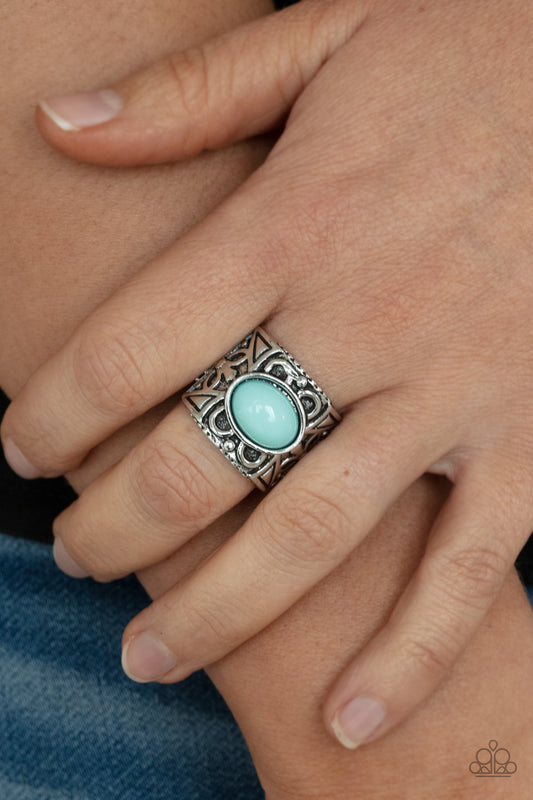 Bubbly Bonanza Blue Ring - Paparazzi Accessories  A bubbly blue bead is pressed into the center of a thick silver frame embossed in a leafy geometric pattern, creating a colorfully whimsical centerpiece. Features a stretchy band for a flexible fit.  All Paparazzi Accessories are lead free and nickel free!  Sold as one individual ring.