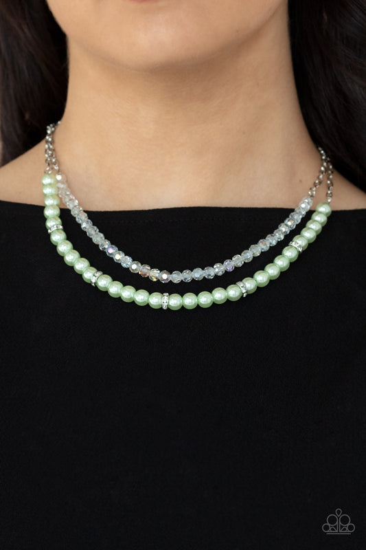 Parisian Princess Green Necklace - Paparazzi Accessories.  A strand of glassy white crystal-like beads and pearly Green Ash beads and white rhinestone encrusted silver rings layer below the collar, creating a timeless display. Features an adjustable clasp closure.  ﻿﻿﻿All Paparazzi Accessories are lead free and nickel free!  Sold as one individual necklace. Includes one pair of matching earrings.