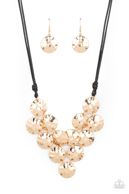 Token Treasure Gold Necklace - Paparazzi Accessories  Featuring a hammered finish, a collection of glistening gold discs delicately connect into a netted pendant at the bottom of knotted black cords for a statement-making look. Features an adjustable clasp closure.  All Paparazzi Accessories are lead free and nickel free!  Sold as one individual necklace. Includes one pair of matching earrings.