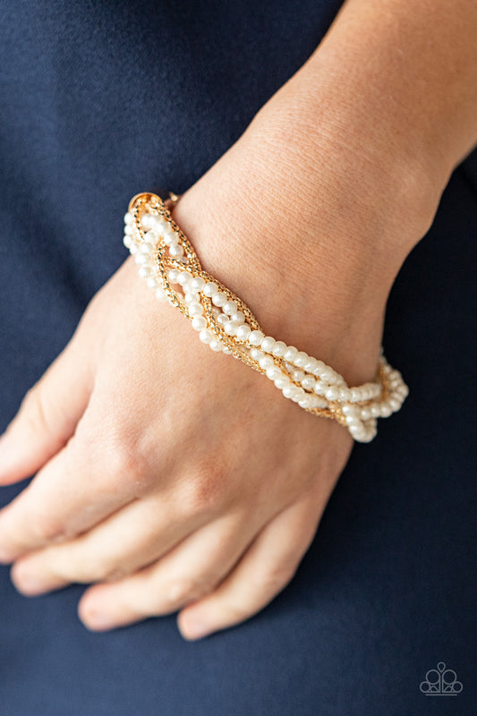 Vintage Variation Gold Pearl Bracelet - Paparazzi Accessories  Capped in gold fittings, strands of bubbly white pearls and dainty gold popcorn chains delicately weave around the wrist, creating an elegantly effervescent display. Features an adjustable clasp closure.  All Paparazzi Accessories are lead free and nickel free!  Sold as one individual bracelet.  Get The Complete Look! Necklace: "Vintage Variation - Gold" (Sold Separately)