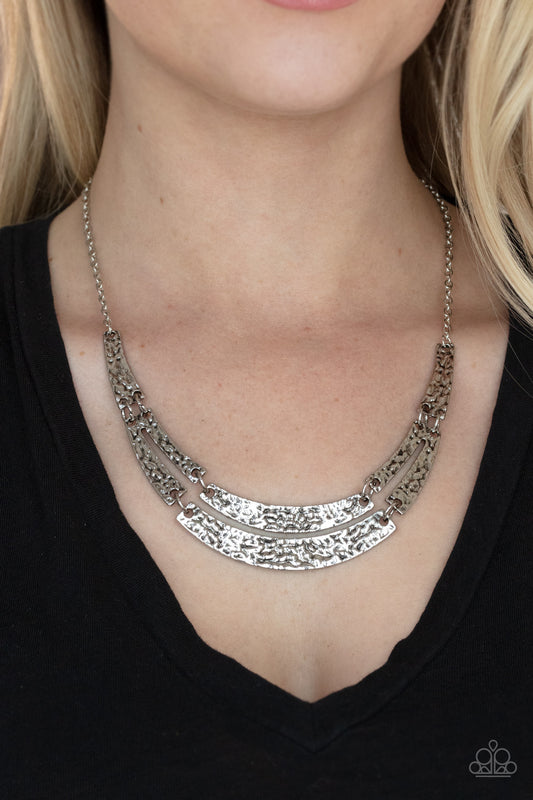 Stick To The ARTIFACTS Silver Necklace - Paparazzi Accessories  Featuring a high-sheen finish, abstract silver frames are embossed in gritty texture as they delicately link below the collar for a rustic display. Features an adjustable clasp closure.  Sold as one individual necklace. Includes one pair of matching earrings.