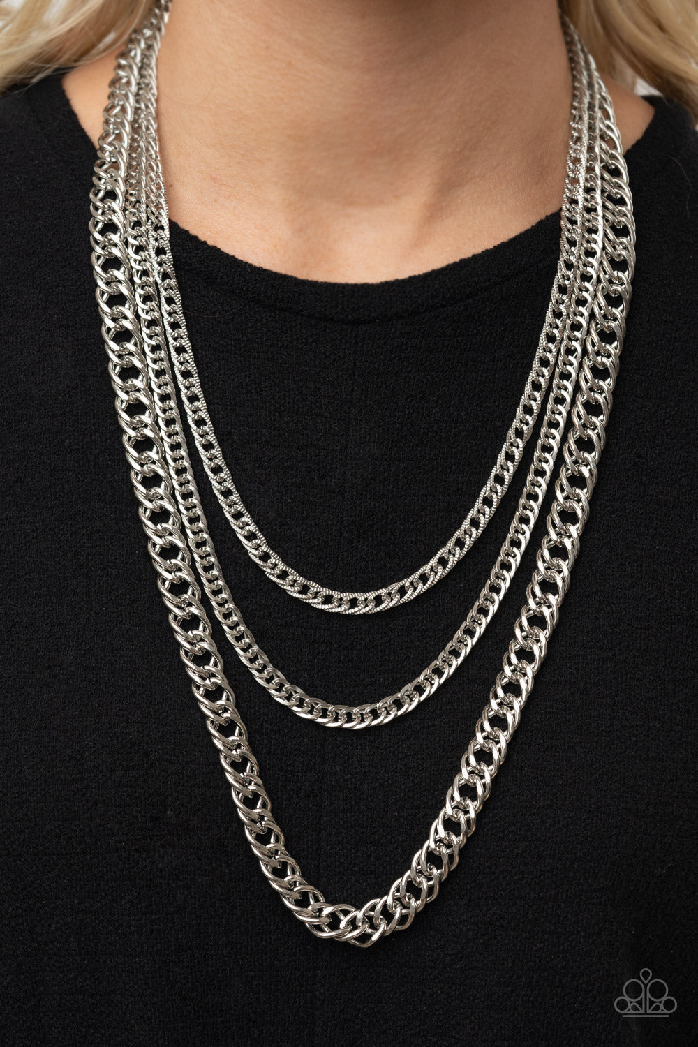 Chain of Champions Silver Necklace - Paparazzi Accessories  Bold layers of glistening silver chains of varying sizes and textures, fall like a weighty medal across the chest creating an edgy industrial effect. Features an adjustable clasp closure.  All Paparazzi Accessories are lead free and nickel free!   Sold as one individual necklace. Includes one pair of matching earrings.