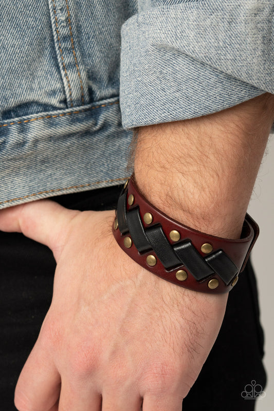 LACES Loaded Brass Urban Wrap Bracelet - Paparazzi Accessories  Thick black leather laces zigzag across the front brass studded brown leather band, creating a rustic display around the wrist. Features an adjustable snap closure.  All Paparazzi Accessories are lead free and nickel free!  Sold as one individual bracelet.