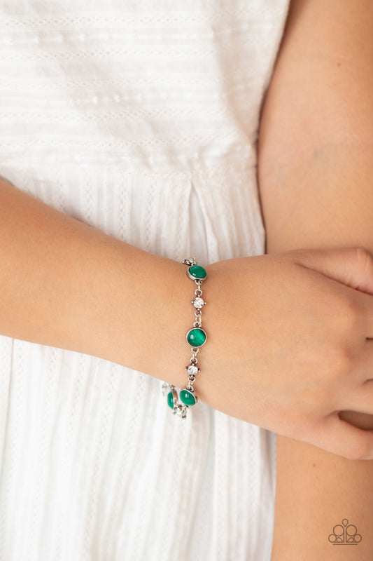 Use Your ILLUMINATION Green Bracelet - Paparazzi Accessories  Encased in antiqued silver fittings, dainty white rhinestones and glowing Mint cat's eye stones delicately link around the wrist for a timeless finish. Features an adjustable clasp closure.  Sold as one individual bracelet.  Get The Complete Look!  Necklace: "Inner Illumination - Green" (Sold Separately)
