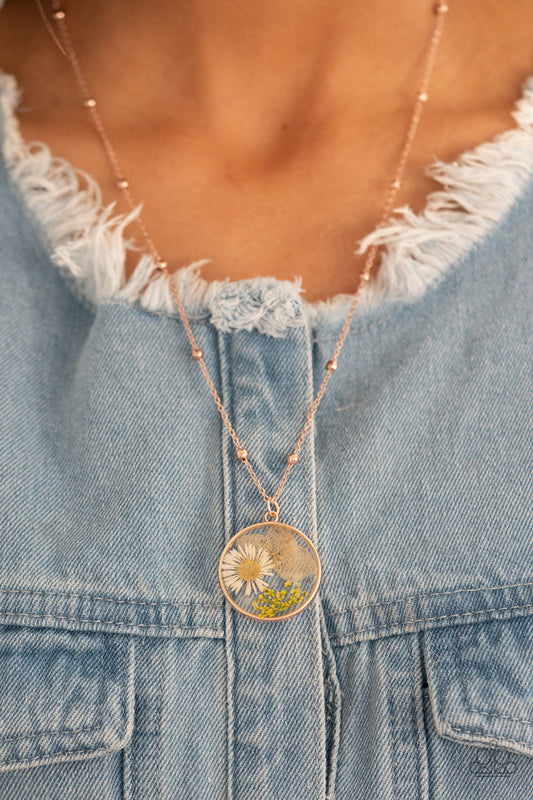 Floral Embrace Rose Gold Necklace - Paparazzi Accessories  A delightful bouquet of pressed flowers encased in a rose gold frame gently sway from a delicate rose gold chain accented with rose gold beads. Features an adjustable clasp closure.  All Paparazzi Accessories are lead free and nickel free!  Sold as one individual necklace. Includes one pair of matching earrings.
