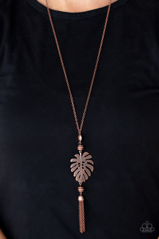 Palm Promenade Copper Necklace - Paparazzi Accessories  Infused with copper beaded accents, a lifelike copper palm leaf frame attaches to the bottom of a rustic copper chain. A copper chain tassel swings from the bottom, adding flirtatious movement to the summery statement piece. Features an adjustable clasp closure.  All Paparazzi Accessories are lead free and nickel free!   Sold as one individual necklace. Includes one pair of matching earrings.
