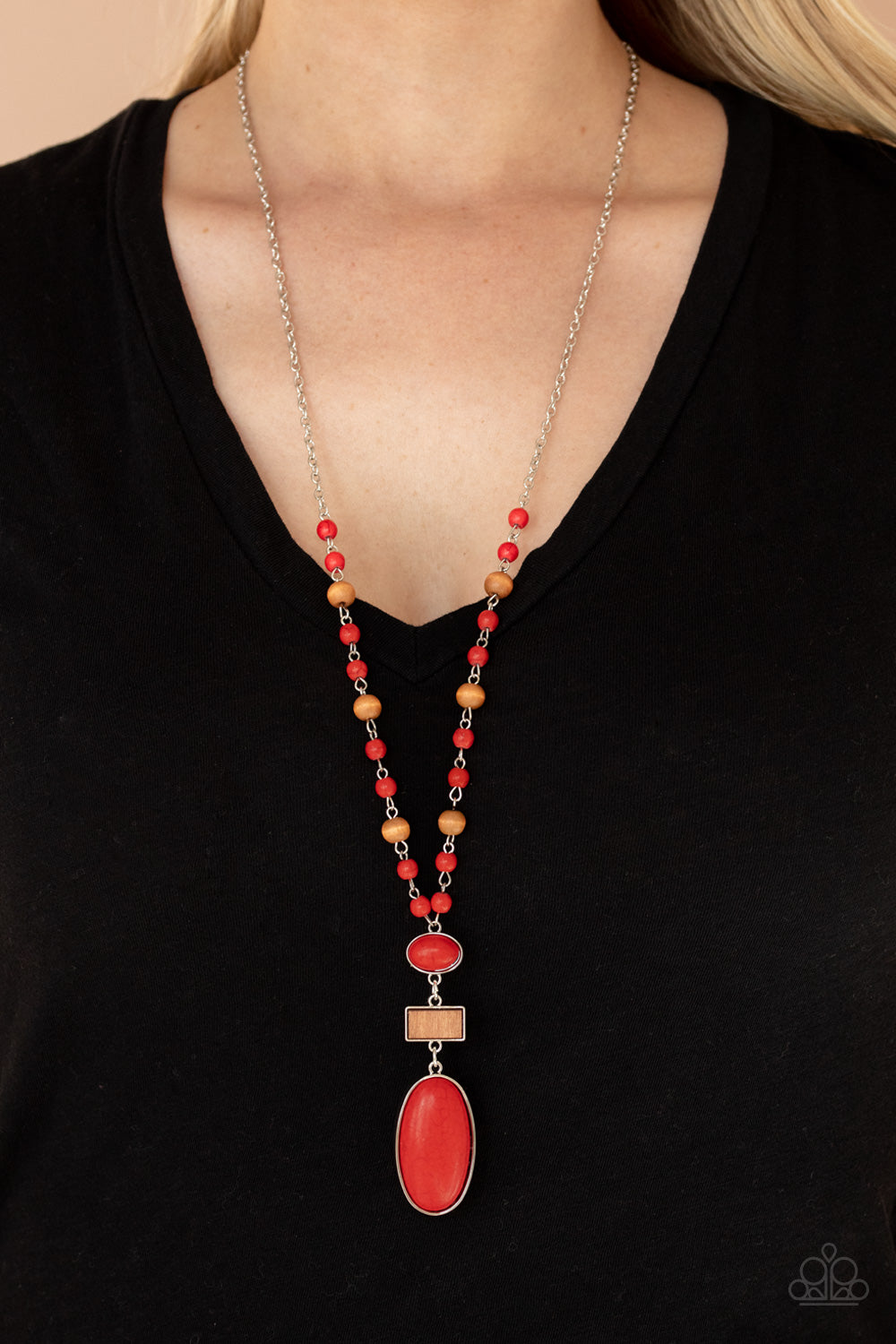 Naturally Essential Red Necklace - Paparazzi Accessories  A dainty collection of fiery red stone and rustic wooden beads connect into an earthy chain across the chest. Featuring sleek silver frames, oval red stones and a rectangular wood frame connect into a dramatically stacked seasonal pendant at the bottom for a colorful display. Features an adjustable clasp closure.  Sold as one individual necklace. Includes one pair of matching earrings.