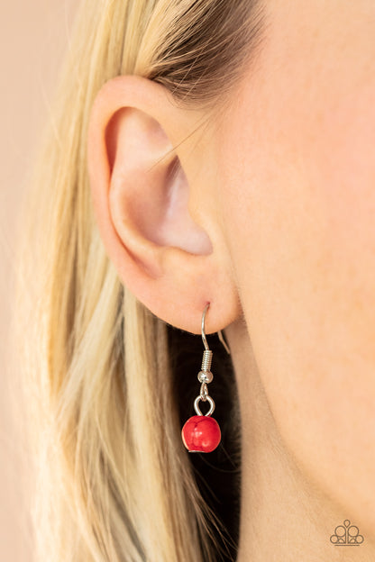 Naturally Essential Red Necklace - Paparazzi Accessories  A dainty collection of fiery red stone and rustic wooden beads connect into an earthy chain across the chest. Featuring sleek silver frames, oval red stones and a rectangular wood frame connect into a dramatically stacked seasonal pendant at the bottom for a colorful display. Features an adjustable clasp closure.  Sold as one individual necklace. Includes one pair of matching earrings.