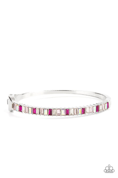 Toast to Twinkle Pink Hinge Bracelet - Paparazzi Accessories  Featuring regal emerald style cuts, a dainty row of pink and white rhinestones are encrusted across the front of a silver cuff-like bangle for a timeless fashion. Features a hinged closure.  Sold as one individual bracelet.