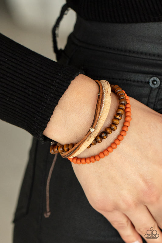 STACK To Basics Orange Urban Bracelet - Paparazzi Accessories.  Featuring a strand of orange wooden beads, a collection of earthy strands of cork, leather, and wood, comes together for a simple handmade feel as it stacks up the wrist. Features an adjustable sliding knot closure.  ﻿﻿﻿All Paparazzi Accessories are lead free and nickel free!  Sold as one individual bracelet.