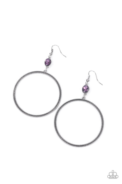 Work That Circuit Purple Earring - Paparazzi Accessories.  A slim oversized silver ring, highlighted by two concentric circles of dotted texture, dangles from an oval purple gem for an edgy refined look. Earring attaches to a standard fishhook fitting.  ﻿All Paparazzi Accessories are lead free and nickel free!  Sold as one pair of earrings.