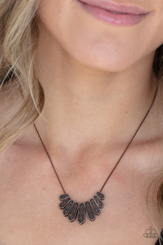 Monumental March Copper Necklace - Paparazzi Accessories  A row of copper obelisk-like monuments gradually decrease in size as they fan out across the collar. Delicately embossed with textured diamond shapes, they march along a dainty round copper chain. Features an adjustable clasp closure.  All Paparazzi Accessories are lead free and nickel free!  Sold as one individual necklace. Includes one pair of matching earrings.