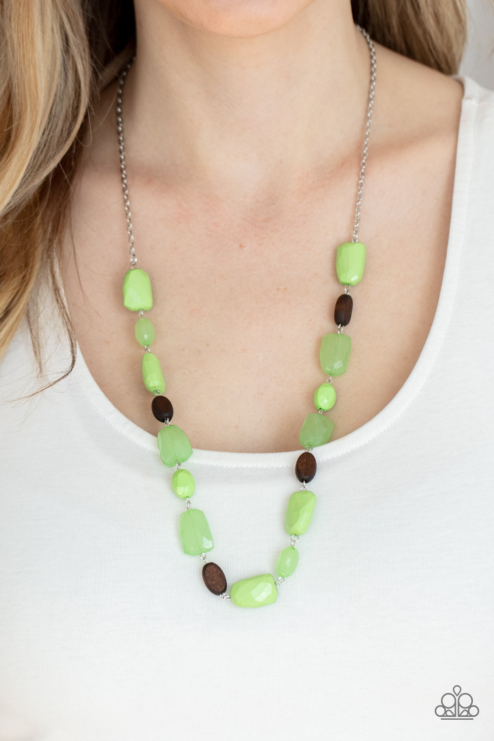 Meadow Escape Green Necklace - Paparazzi Accessories  Varying in opacity, a mixed assortment of faceted Apple Green beads delicately link with dainty wooden beads across the chest, creating a whimsically earthy display. Features an adjustable clasp closure.  All Paparazzi Accessories are lead free and nickel free!  Sold as one individual necklace. Includes one pair of matching earrings.