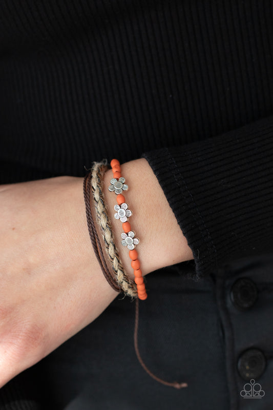 Raffia Remix Orange Urban Bracelet - Paparazzi Accessories  Three delightful etched silver flowers stand out on a strand of orange wooden beads. Paired with an assortment of braided twine and cording, the set wraps around the wrist for an earthy remix. Features an adjustable sliding knot closure.  All Paparazzi Accessories are lead free and nickel free!  Sold as one individual bracelet.