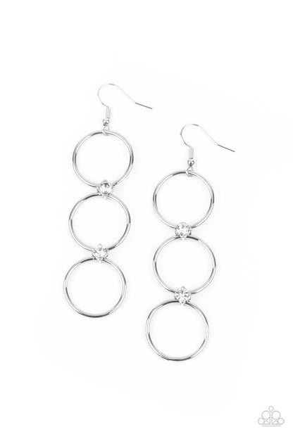 Refined Society White Earring - Paparazzi Accessories. Three silver hoops, joined together by small sparkly white rhinestone accents, dangle from the ear for a classically refined finish. Earring attaches to a standard fishhook fitting.  All Paparazzi Accessories are lead free and nickel free!  Sold as one pair of earrings.