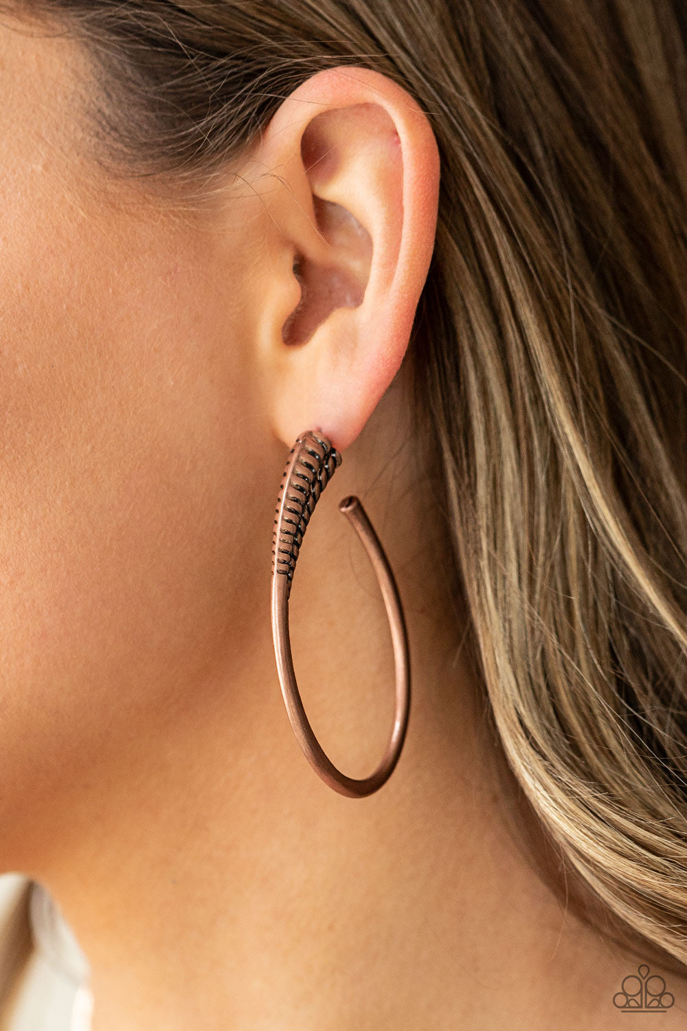 Fully Loaded Copper Hoop Earring - Paparazzi Accessories  A spiral of texture resembling a coil anchors an exaggerated oblong copper hoop that wraps around the ear. The high-sheen finish on the curved bar adds a hint of drama, as it refracts the light in a knockout finish. Earring attaches to a standard post fitting. Hoop measures approximately 1 1/2" in diameter.  All Paparazzi Accessories are lead free and nickel free!  Sold as one pair of hoop earrings.