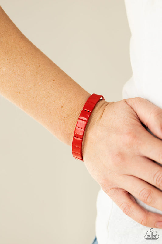 Material Movement Red Bracelet - Paparazzi Accessories  Metal rectangles painted in a fiery red finish are threaded along stretchy bands, forming a gorgeous pop of color that wraps around the wrist.  All Paparazzi Accessories are lead free and nickel free!  Sold as one individual bracelet.