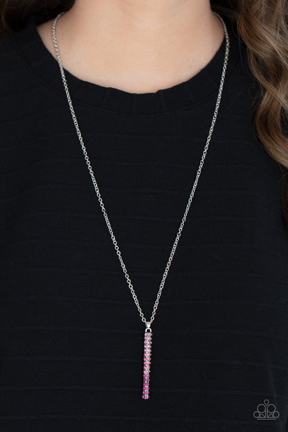 Tower Of Transcendence Pink Necklace - Paparazzi Accessories  A sparkly collection of spectrum pink rhinestones are encrusted along a silver pendulum that swings along the bottom of a silver chain, creating a glittery ombre effect. Features an adjustable clasp closure.  Sold as one individual necklace. Includes one pair of matching earrings.