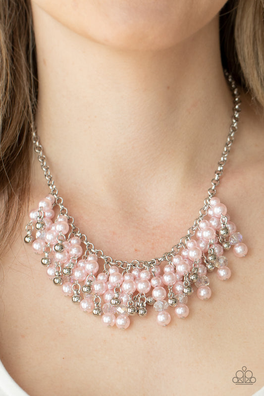 Champagne Dreams Pink Necklace - Paparazzi Accessories  A bubbly collection of pink pearls, silver beads, and sparkly crystal-like beads are threaded along metallic rods that trickle from the bottom of a shimmery silver chain, creating an elegantly effervescent fringe below the collar. Features an adjustable clasp closure.  All Paparazzi Accessories are lead free and nickel free!  Sold as one individual necklace. Includes one pair of matching earrings.